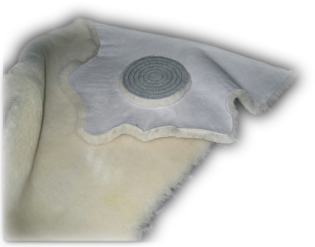 Natural lambskin hide with a spiral-stitched polishing pad